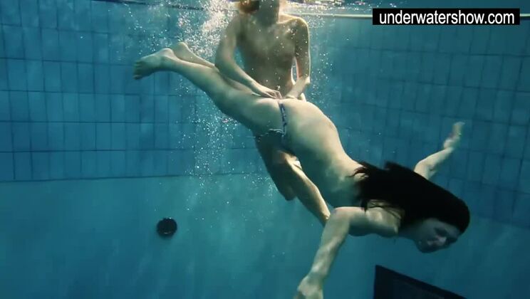 Two sexy amateurs showing their bodies off under water