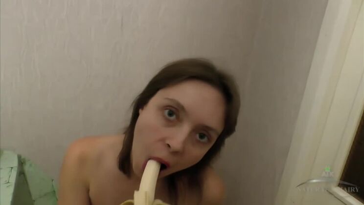 Sabrina poses and eats a banana
