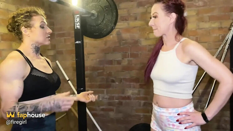 Muscular Lesbian Trainer Seduces Hot Firegirl in Gym